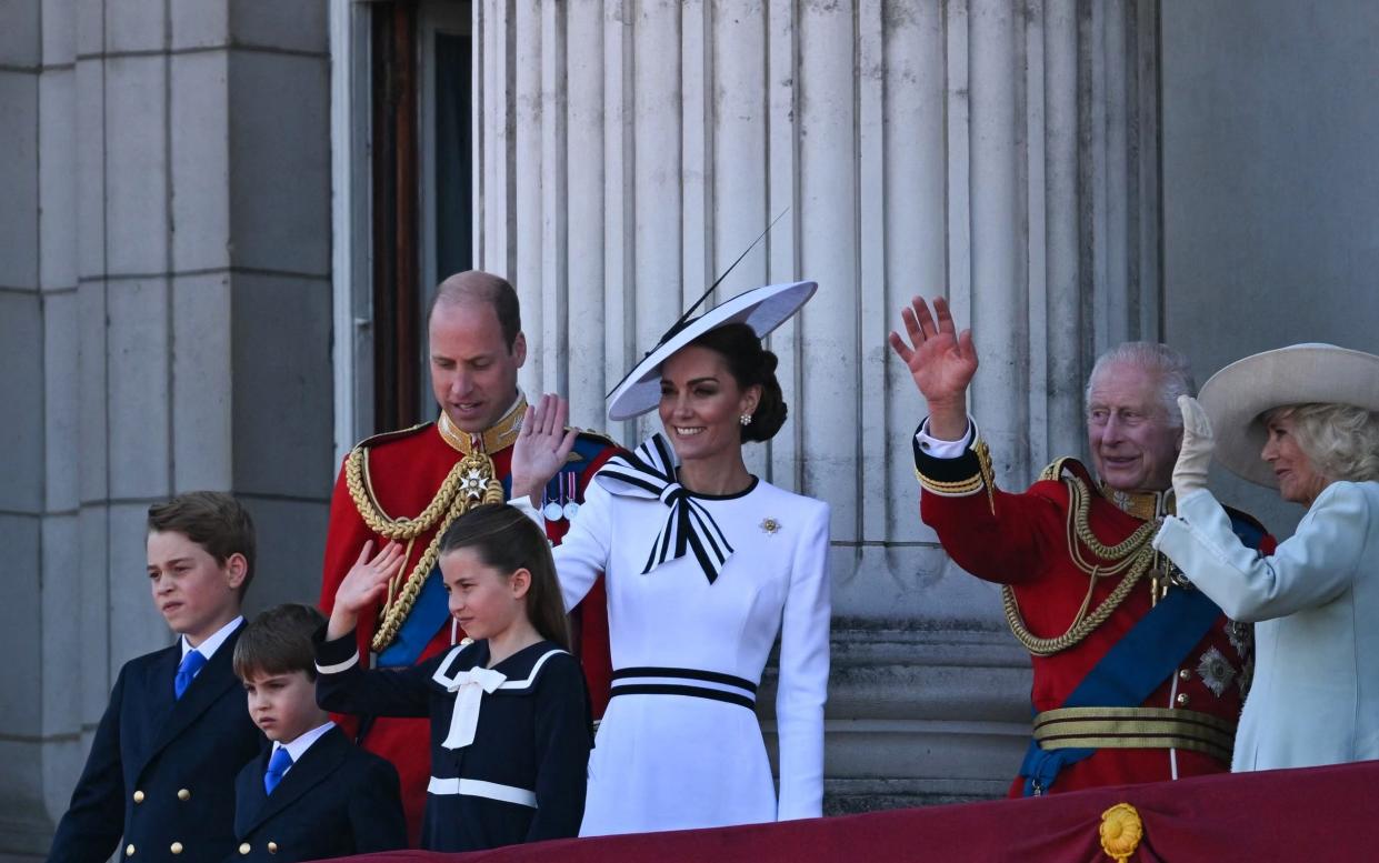Royal family wave from the balcony of Buckingham Palace after attending the King's Birthday Parade