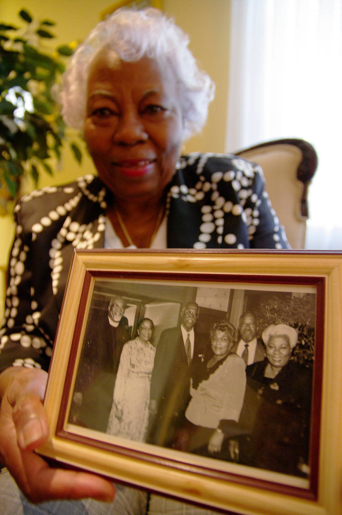 Leona Cooper holds a picture of some of her family members on March 1, 2010.  