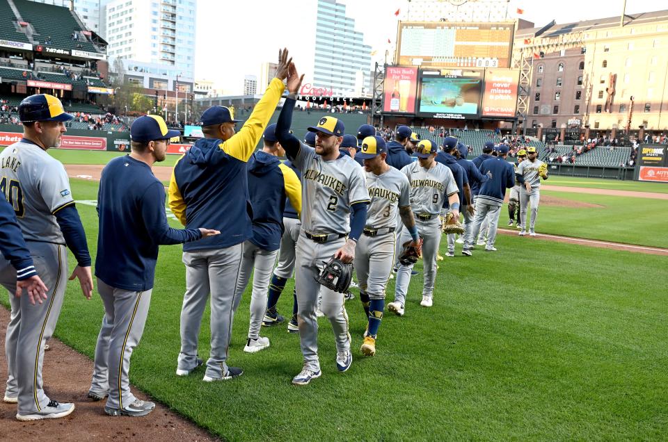 Brewers players celebrate Saturday after beating the Orioles to improve their record to an National League best 10-3.