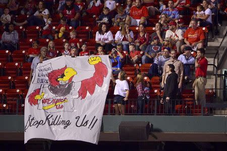 Sep 29, 2017; St. Louis, MO, USA; Protesters display a sign during the third inning of a game between the St. Louis Cardinals and the Milwaukee Brewers at Busch Stadium. Mandatory Credit: Jeff Curry-USA TODAY Sports