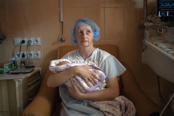 PHOTO: Katya Buravtsova, 35, holds her son Illiusha inside Pokrovsk maternity hospital, Donetsk region, eastern Ukraine, June 29, 2022. (Marko Djurica/Reuters)