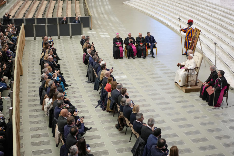 Pope Francis meets the members of the 2023 World Youth Day organizing committee, in the Pope Paul VI hall at the Vatican, Thursday, Nov. 30, 2023. (AP Photo/Andrew Medichini)