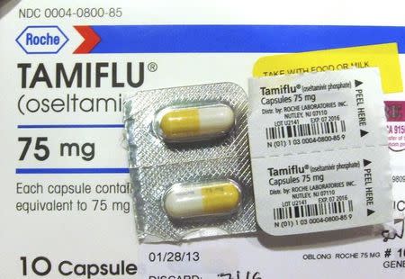 Four capules of Tamiflu are pictured on a Tamiflu box in Burbank, California, January 31, 2013. REUTERS/Fred Prouser
