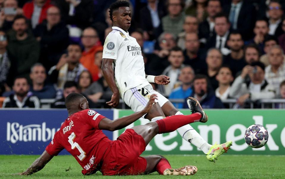 Real Madrid&#39;s Brazilian forward Vinicius Junior vies with Liverpool&#39;s French defender Ibrahima Konate (down) during the UEFA Champions League last 16 second leg football match between Real Madrid CF and Liverpool FC at the Santiago Bernabeu - Getty Images/Pierre-Philippe Marcou