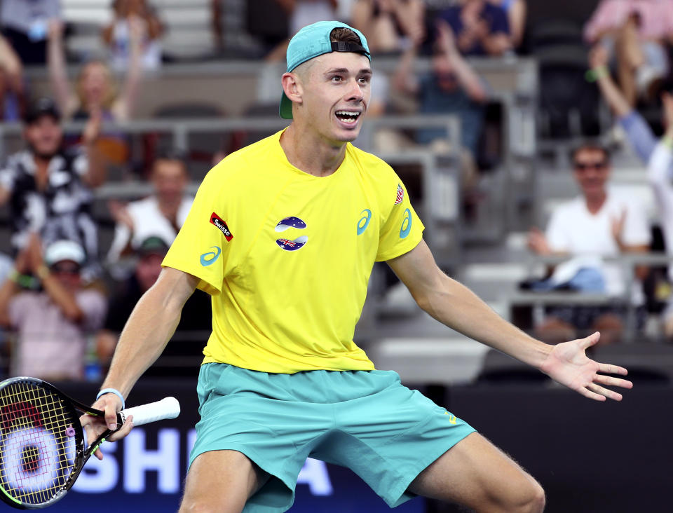 Alex de Minaur of Australia reacts after he won his match against Denis Shapovalov of Canada at the ATP Cup tennis tournament in Brisbane, Australia, Sunday, Jan. 5, 2020. (AP Photo/Tertius Pickard)