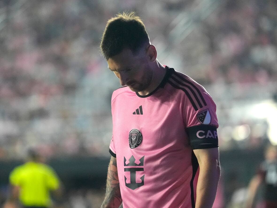 Inter Miami forward Lionel Messi walks on the field at a match with D.C. United in Washington last month. It's a sight a proposed class action lawsuit says B.C. fans were unable to witness. (Lynne Sladky/The Associated Press - image credit)