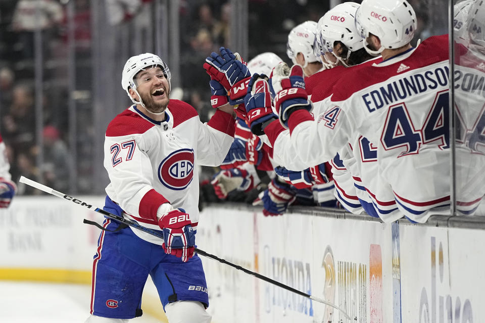 Montreal Canadiens left wing Jonathan Drouin is congratulated by teammates after scoring during the first period of an NHL hockey game against the Anaheim Ducks Friday, March 3, 2023, in Anaheim, Calif. (AP Photo/Mark J. Terrill)