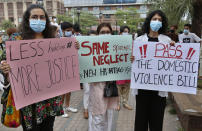 Women's rights activists take part in a demonstration to condemn the violence against women, in Lahore, Pakistan, Saturday, July 24, 2021. The beheading of a young woman in an upscale neighborhood of Pakistan's capital has shone a spotlight on the relentless violence against women in the country. Rights activists say such gender-based assaults are on the rise as Pakistan barrels toward greater religious extremism. (AP Photo/K.M. Chaudhry)