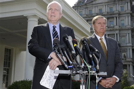 U.S. Senator John McCain (R-AZ), (L), makes remarks to the media as U.S. Senator Lindsey Graham (R-SC) listens, after meeting with U.S. President Barack Obama at the White House, on possible military action against Syria, in Washington September 2, 2013. REUTERS/Mike Theiler