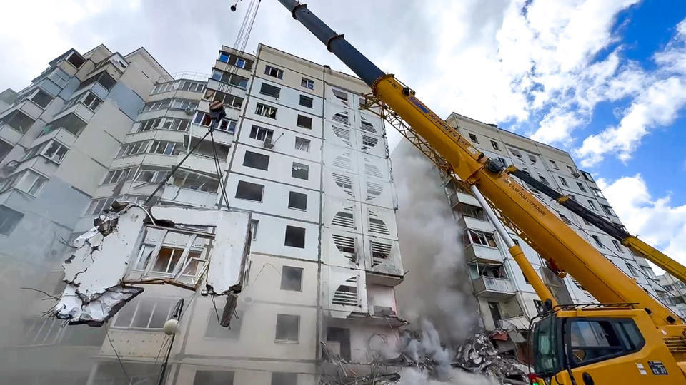 This photo taken from video released by Belgorod regional governor Vyacheslav Gladkov's Telegram channel on Sunday, May 12, 2024, A Russian emergency service crane works at the scene of a partially collapsed block of flats after a missile attack by the Ukrainian Armed Forces in the Russian city of Belgorod, Russia. In a statement, Russia's Investigative Committee, the country's top law enforcement agency, said that the 10-story block had been hit by Ukrainian shelling. (Belgorod Region Governor Vyacheslav Gladkov Telegram channel via AP)