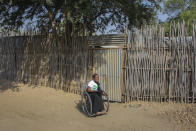 Wheelchair user Susan Samson leaves her home to go to church in Juba, South Sudan Sunday, Jan. 15, 2023. When Pope Francis arrives in Congo and South Sudan next week, thousands of people will take special note of a gesture more grounded than the sign of the cross - watching from their wheelchairs, they will relate to the way he uses his. (AP Photo)