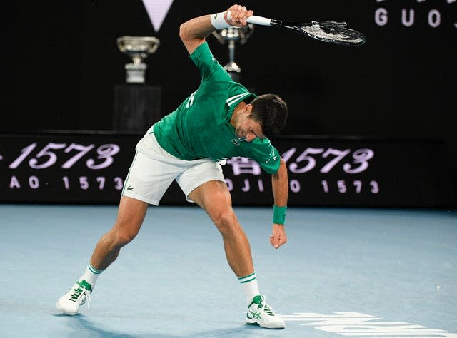 Novak Djokovic smashes his racket during his victory over Alexander Zverev