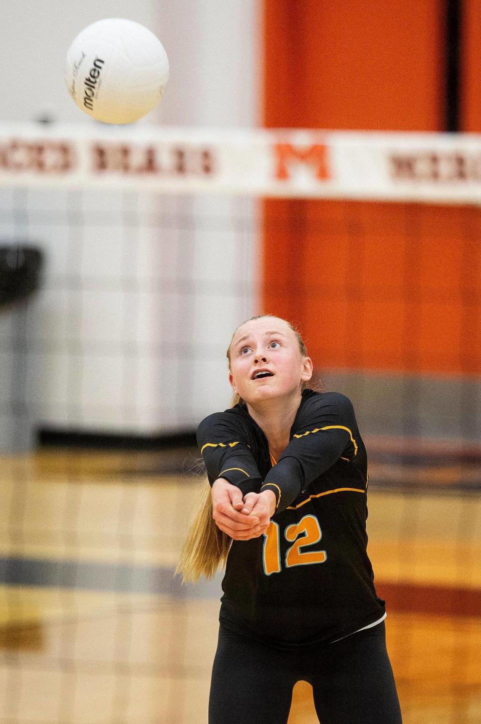 El Capitan junior Chloe Grever (12) reaches for the ball during a match against Merced at Merced High School in Merced, Calif., on Wednesday, Oct. 4, 2023. The Gauchos swept the Bears 3-0.
