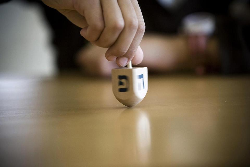 Dreidel is a traditional children’s game played at Hanukkah (Jonathan Nackstrand / AFP / Getty Images)