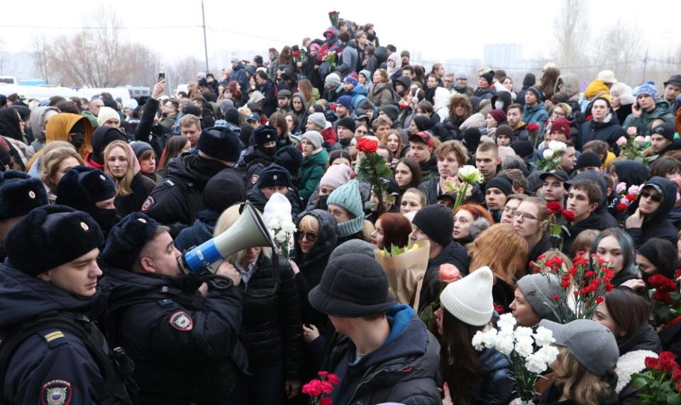 Russian Police speak to people gathered near the Borisov cemetery during the funeral for Alexei Navalny in Moscow, on March 1, 2024.<span class="copyright">Contributor/Getty Images</span>