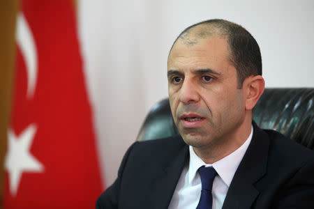 Kudret Ozersay, Foreign Minister of Northern Cyprus, speaks during an interview with Reuters in his office in northern part of Nicosia, Cyprus March 9, 2018. REUTERS/Yiannis Kourtoglou