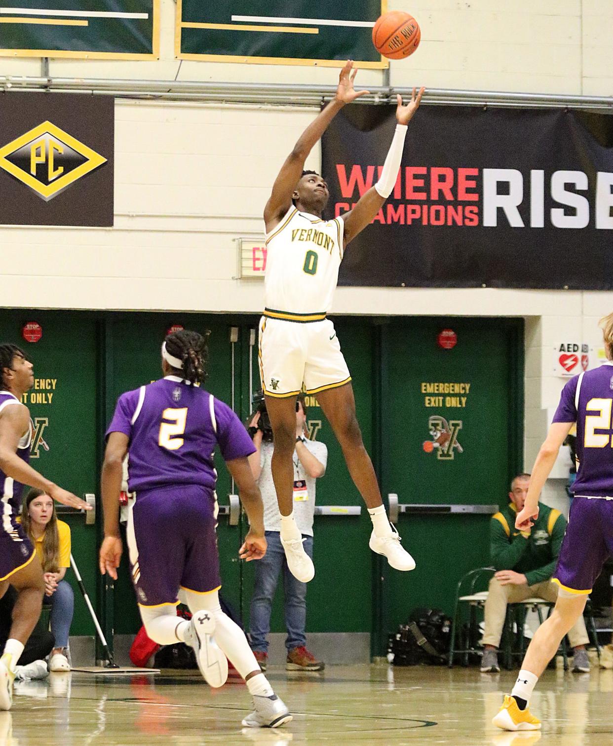 Vermont's Ileri Ayo-Faleye goes up for a pass into the post during the Catamounts 75-72 win over Albany in the America East quarterfinals on Saturday afternoon at Patrick Gym.