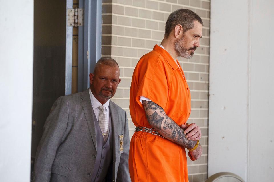 Escaped inmate Casey White, right, is escorted from the Lauderdale County Courthouse after receiving a life sentence, Thursday, June 8, 2023, in Florence, Ala. White, who escaped with help from a jail official who ultimately ended up taking her own life as cops closed in, was sentenced Thursday to life in prison. (Dan Busey/The TimesDaily via AP)