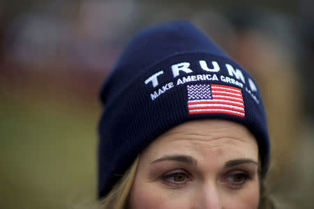 FILE PHOTO: A supporter of President Donald Trump wears a campaign hat during a "People 4 Trump" rally at Neshaminy State Park in Bensalem, Pennsylvania, U.S. March 4, 2017. REUTERS/Mark Makela/File Photo