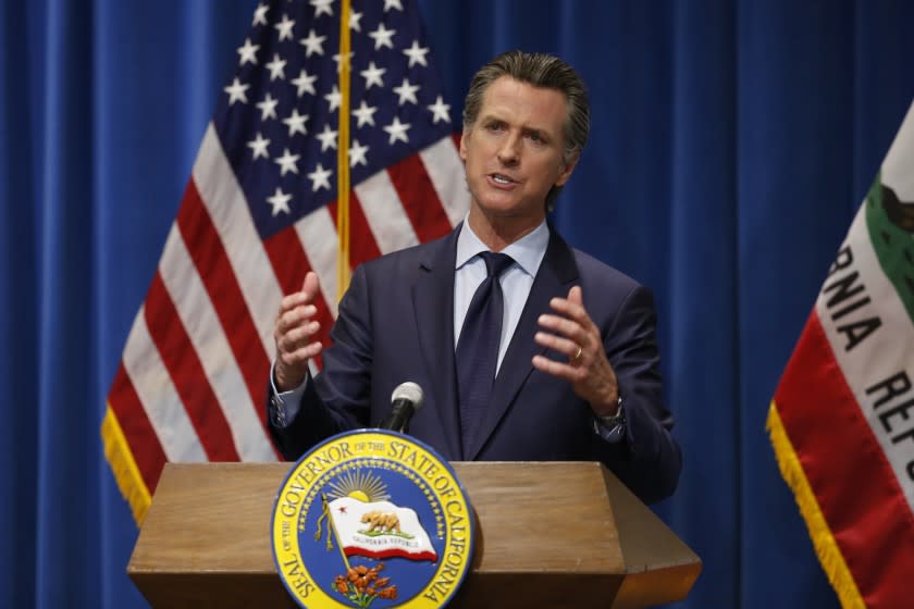 California Gov. Gavin Newsom discusses his revised 2020-2021 state budget during a news conference in Sacramento, Calif., Thursday, May 14, 2020. Reflecting the financial hit California is already seeing from the coronavirus, Newsom proposed cutting $6.1 billion from a variety of programs in a state budget he says prioritizes public education, public health and public safety. (AP Photo/Rich Pedroncelli, Pool)