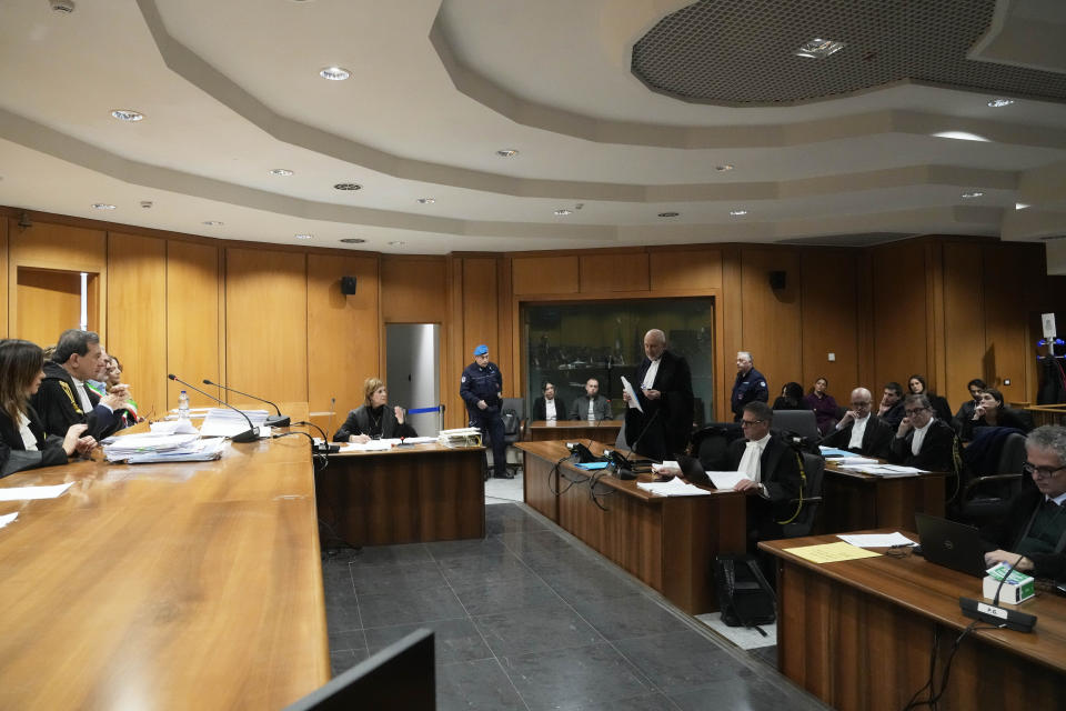 Gabriel Natale-Hjorth, and Finnegan Lee Elder, background centre, attend the appeal trial for the killing of Italian policeman Mario Cerciello Rega, in Rome, Friday, March. 8, 2024. The two American men face a new trial in the slaying of an Italian plainclothes police officer during a botched sting operation after Italy's highest court threw out their convictions. (AP Photo/Gregorio Borgia)