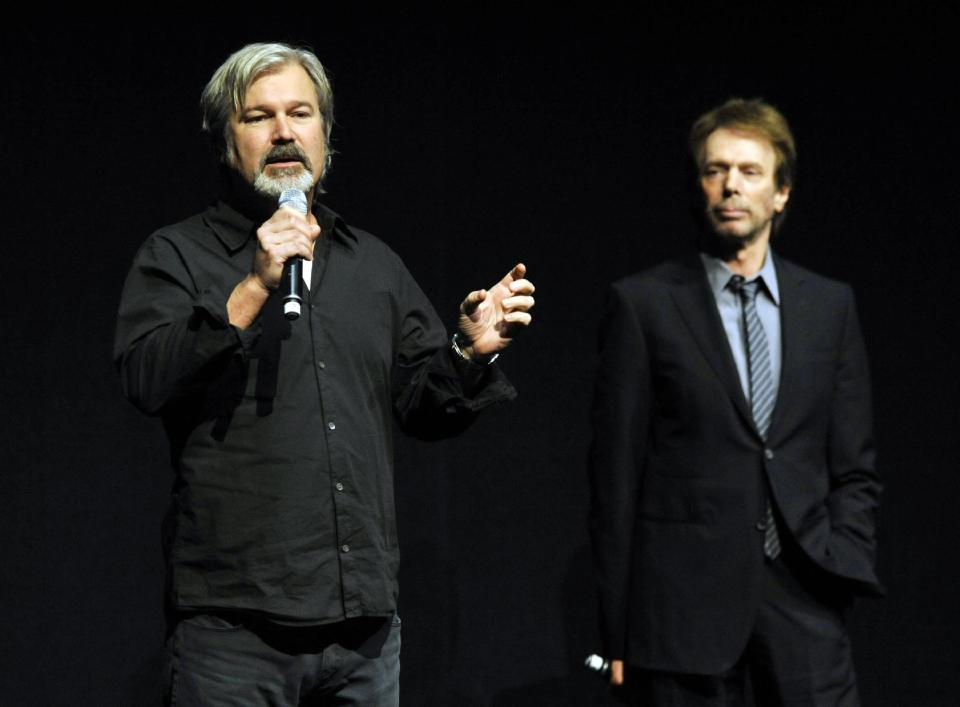 Gore Verbinski, left, director of the upcoming film "The Lone Ranger," addresses the audience as the film's producer Jerry Bruckheimer looks on during the Walt Disney Studios presentation at CinemaCon 2013 at Caesars Palace on Wednesday, April 17, 2013 in Las Vegas. (Photo by Chris Pizzello/Invision/AP)