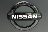 FILE - In this July 25, 2019, file, photo, Nissan logo is seen at a Nissan car gallery in Tokyo. Japanese automaker Nissan Motor Co. has named the head of its China business, Makoto Uchida, to be its new CEO. (AP Photo/Eugene Hoshiko, File)