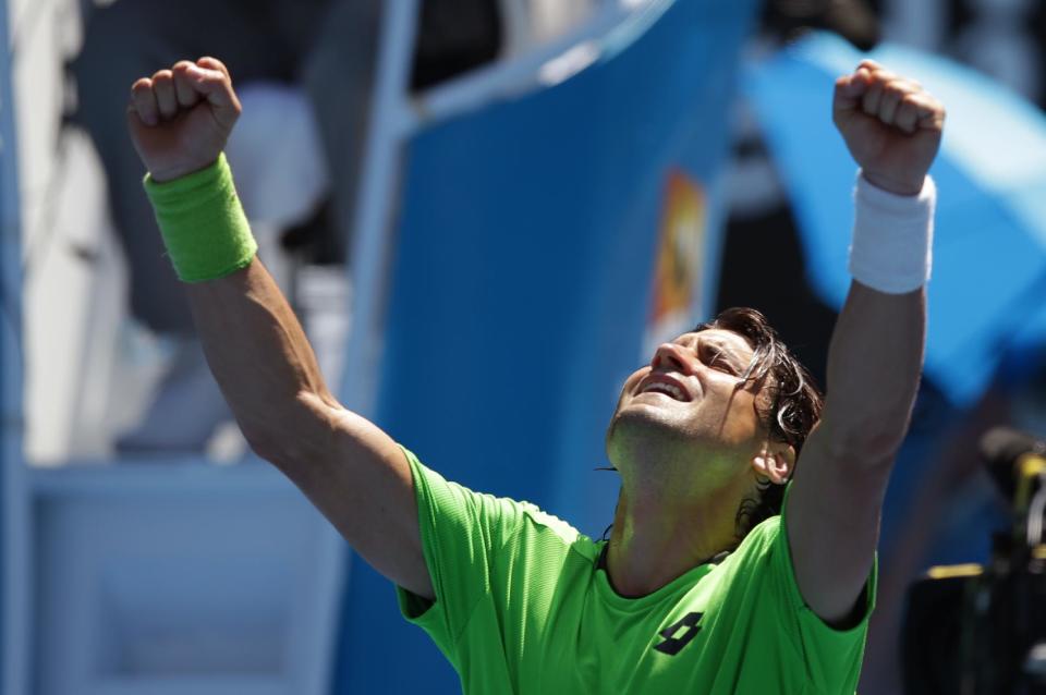 David Ferrer of Spain celebrates after winning over Jeremy Chardy of France during their third round match at the Australian Open tennis championship in Melbourne, Australia, Friday, Jan. 17, 2014.(AP Photo/Aaron Favila)