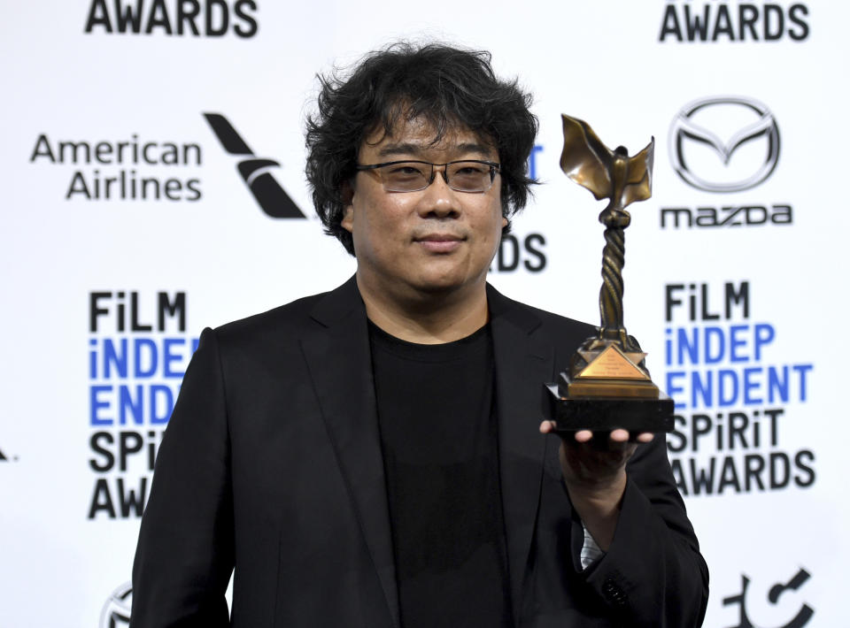 Bong Joon-ho poses in the press room with the award for best international film for "Parasite" at the 35th Film Independent Spirit Awards on Saturday, Feb. 8, 2020, in Santa Monica, Calif. (Photo by Richard Shotwell/Invision/AP)