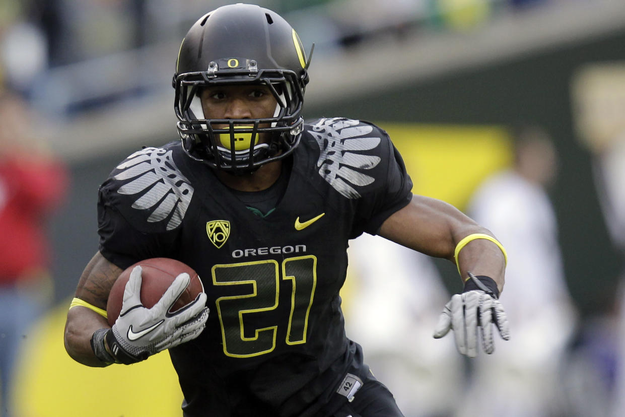 FILE - Oregon running back LaMichael James (21) carries the ball during the third quarter of an NCAA college football game against Washington, Saturday, Nov. 6, 2010, in Eugene, Ore. LaMichael James was elected to the College Football Hall of Fame on Monday, Jan. 9, 2023. (AP Photo/Rick Bowmer, File)