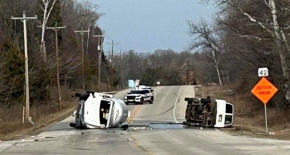 A propane tanker truck and a van lie on their sides on State 42 on Tuesday after they collided on the highway at Town Line Road between Sturgeon Bay and Carlsville, causing a propane leak that shut down the highway for more than four hours.