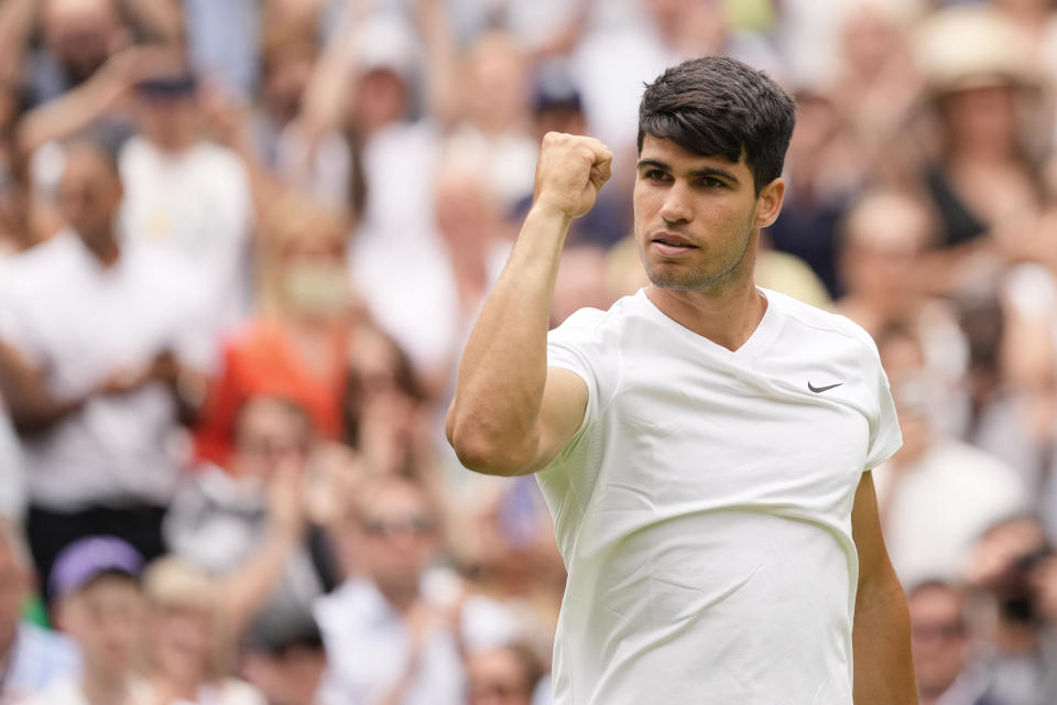 Carlos Alcaraz of Spain reacts after defeating Mark Lajal of Estonia in their first round match of the Wimbledon tennis championships in London, Monday, July 1, 2024. (AP Photo/Alberto Pezzali)