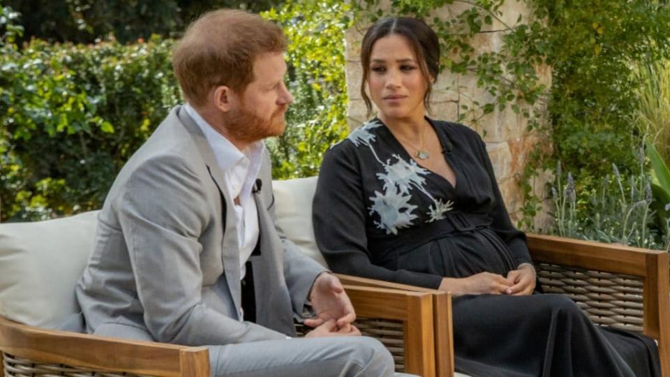 Prince Harry and Meghan Markle, the Duke and Duchess of Sussex, are shown in their recent interview on CBS. (Photo by Harpo Productions/Joe Pugliese via Getty Images)