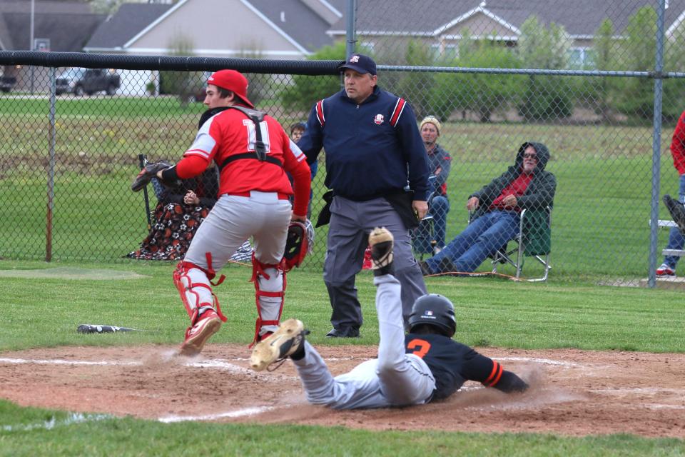 Gibsonburg&#39;s Nolan Hoover scores head first.