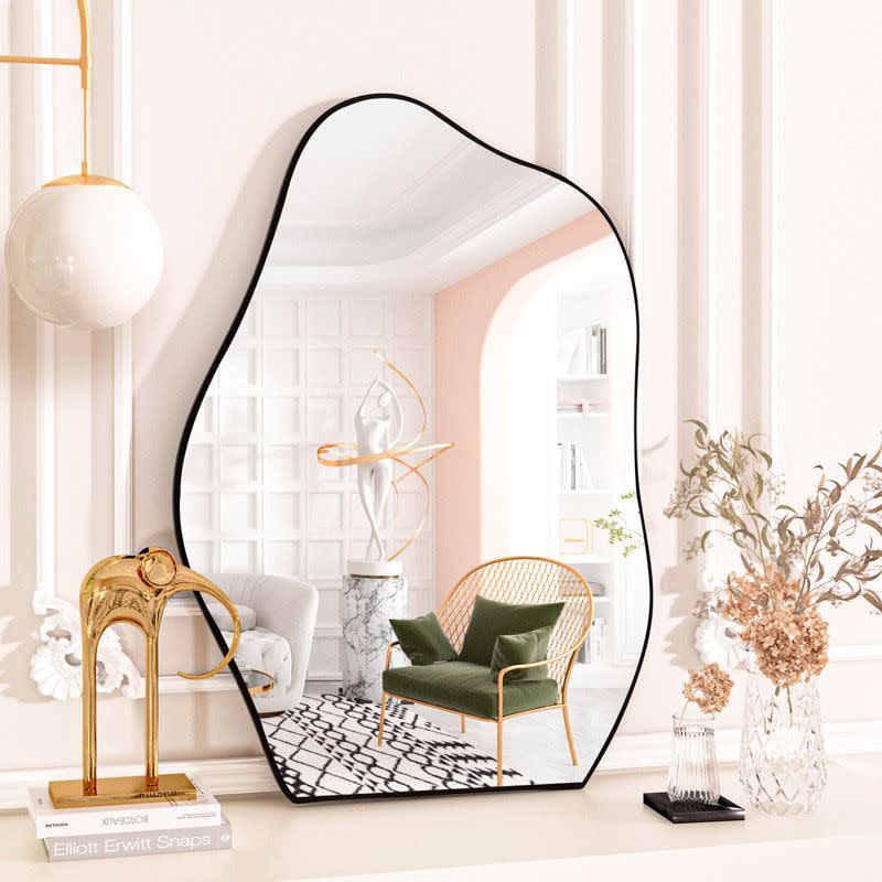 <p><a href="https://go.redirectingat.com?id=74968X1596630&url=https%3A%2F%2Fwww.wayfair.com%2F--%2Fpdp%2Forren-ellis--irregular-bathroom-mirror-x110359024-l41-w009248913.html&sref=https%3A%2F%2Fwww.cosmopolitan.com%2Flifestyle%2Fa42450300%2Finterior-design-trends-2023%2F" rel="nofollow noopener" target="_blank" data-ylk="slk:Shop Now;elm:context_link;itc:0;sec:content-canvas" class="link ">Shop Now</a></p><p>Irregular Bathroom Mirror</p><p>$78.99</p><p>wayfair.com</p><span class="copyright">Wayfair</span>