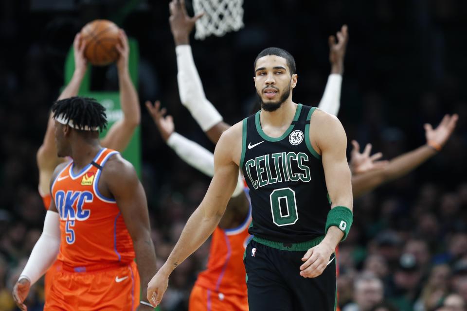 Boston Celtics' Jayson Tatum (0) on the court during the second half of an NBA basketball game against the Oklahoma City Thunder, Sunday, March, 8, 2020, in Boston. (AP Photo/Michael Dwyer)