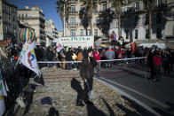 A student looks on during a demonstration in Marseille, southern France, Tuesday Jan. 26, 2021. Teachers and university students marched together in protests or went on strike Tuesday around France to demand more government support amid the pandemic. (AP Photo/Daniel Cole)