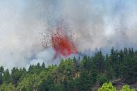 Lava and smoke are seen followng the eruption of a volcano in Spain