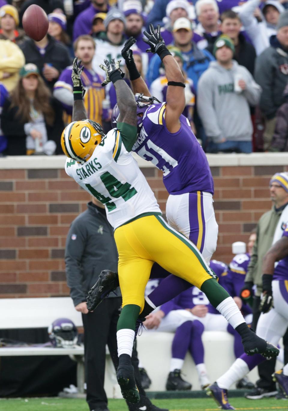 Minnesota Vikings cornerback Josh Robinson, right, breaks up a pass intended for Green Bay Packers running back James Starks (44) during the second half of an NFL football game, Sunday, Nov. 23, 2014, in Minneapolis. (AP Photo/Jim Mone)