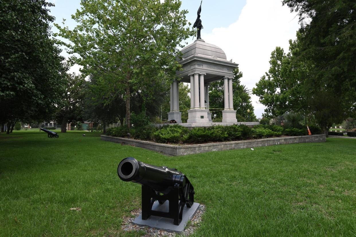 The Confederate monument in Springfield Park has two bronze statues. The statue inside the monument is a woman reading a book to two children and the statue on top of it is a woman holding a Confederate flag.