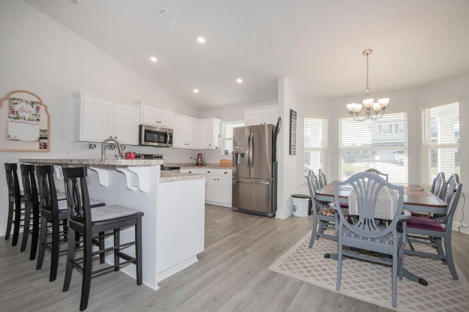 Home chefs will appreciate the open kitchen with stainless appliances.