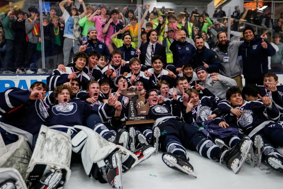 Bloomfield Hills Cranbrook Kingswood players celebrate 3-2 win over East Grand Rapids in the third overtime of MHSAA Division 3 hockey final at USA Hockey Arena in Plymouth on Saturday, March 9, 2024.