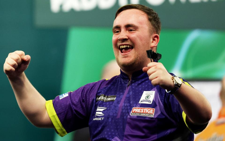 Luke Littler celebrates winning his round one match against Christian Kist on day six of the World Darts Championship at Alexandra Palace on December 20, 2023 in London, England - Sixteen-year-old Luke Littler lights up World Darts Championship – and celebrates with kebab