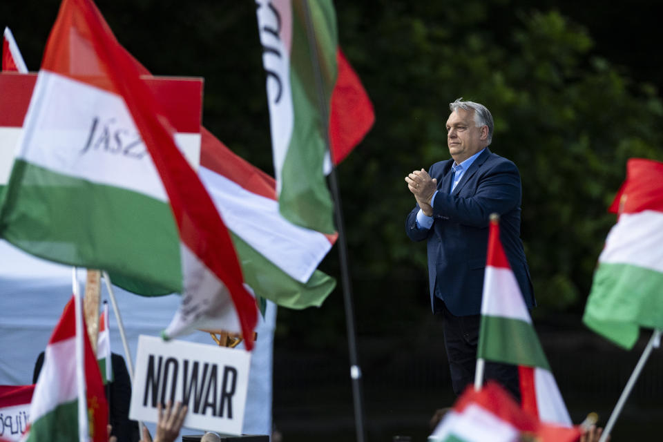 Hungary's Prime Minister Viktor Orbán addresses people as they gather to support him and his party during a "peace march" in Budapest, Hungary, Saturday, June 1, 2024. A crowd of tens of thousands gathered in Hungary’s capital on Saturday in a show of strength behind Orbán a week ahead of European Parliament elections, a contest that he has cast as an existential turning point between peace and a world war. (AP Photo/Denes Erdos)