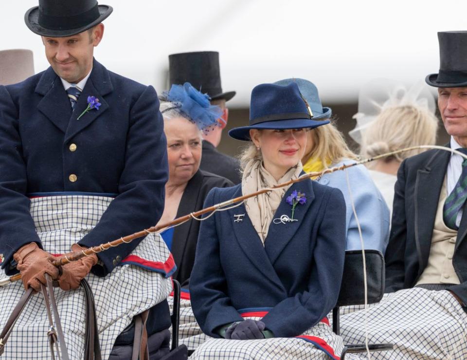 Lady Louise wearing navy trilby and horse print scarf