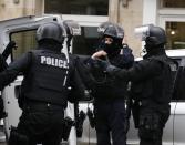 Members of the French national police intervention group (BRI) arrive at the scene where a female police officer was shot dead in Montrouge, a southern suburb of Paris