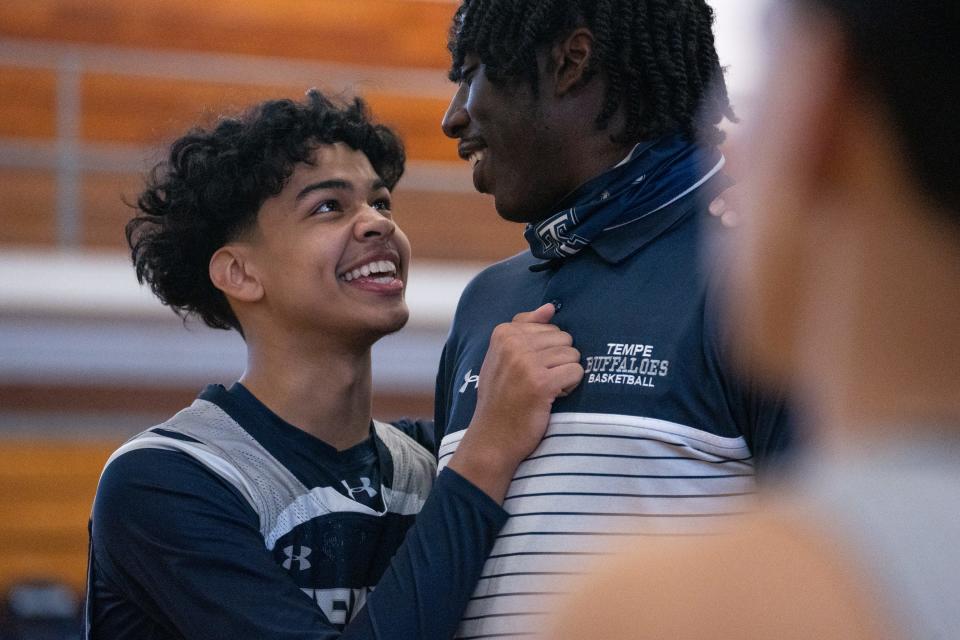 Coach Devin Kirby (right) talks with Torian Gant during basketball practice, January 26, 2022, in the gym at Tempe High School, Tempe, Arizona.