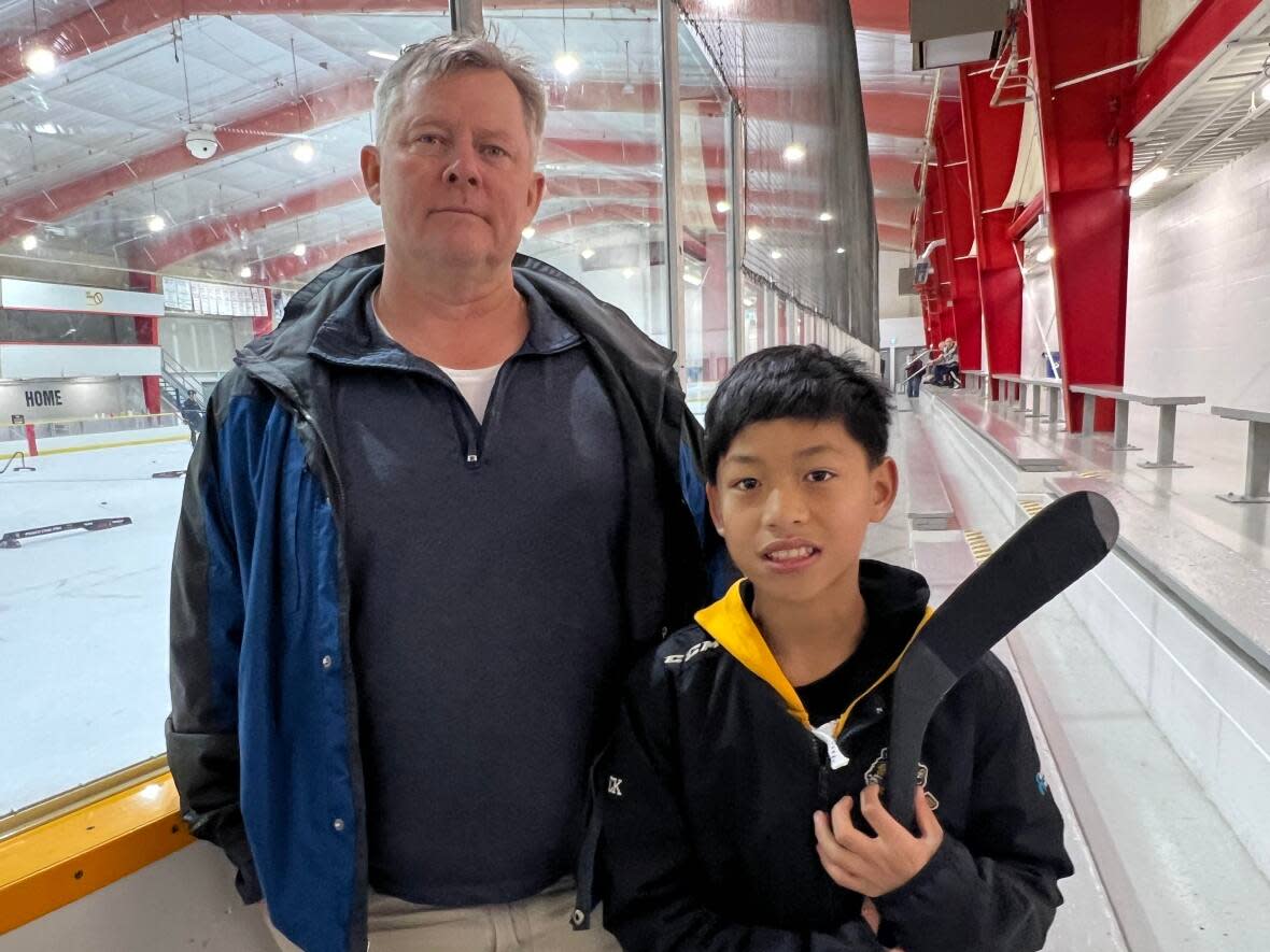 Harry Chadwick's son Harrison was legally adopted from China before he turned two years old, but he needs to get a transfer from his country of birth before he can play in a licensed program in Canada.  (Andrew Lupton/CBC News - image credit)