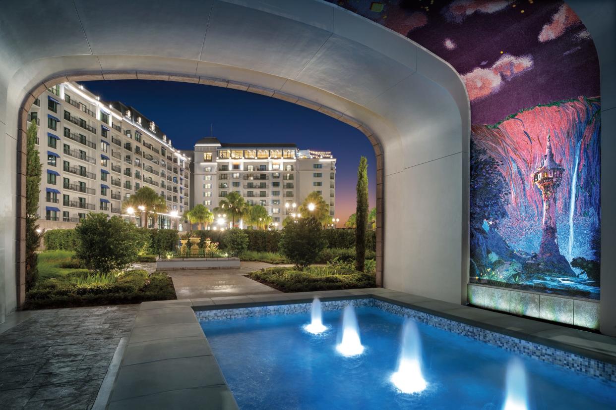 Intricate mosaics line a short tunnel connecting Disney's Riviera Resort to its Skyliner station.