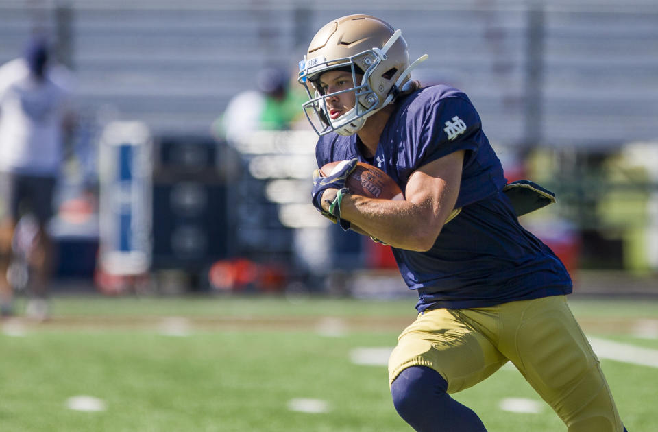 FILE - In this Aug. 8, 2019, file photo, Notre Dame's Chris Finke runs with the ball during NCAA college football practice in Culver, Ind. Notre Dame has an experienced wide receiver corps. (Robert Franklin/South Bend Tribune via AP, File)